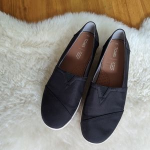 Toms black canvas slip ons